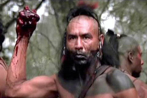 Wes Studi as Magua. He has just cut the heart out of his arch enemy Col. Munro. This act of vengeance ironically does not satisfy his thirst for revenge as he seeks to destroy Munro's daughters as well. That is the way of bitterness. Even when revenge is taken the bitter person is not satisfied.